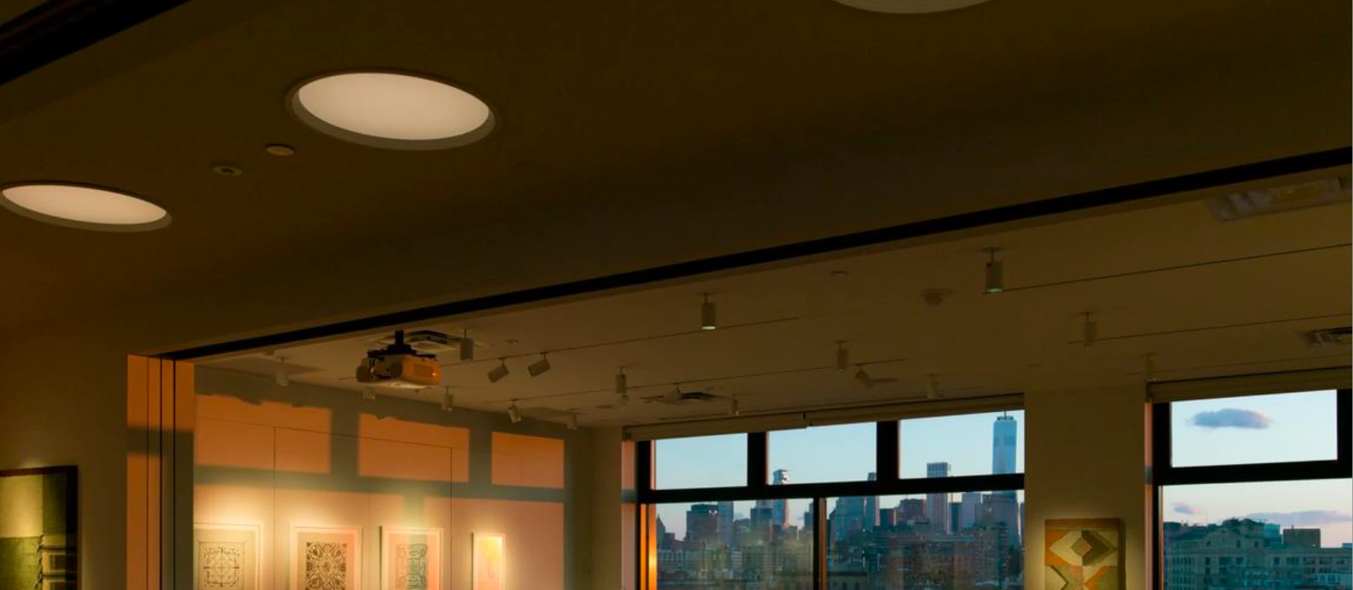 The Affirmation Arts gallery at dusk, looking toward the Manhattan skyline